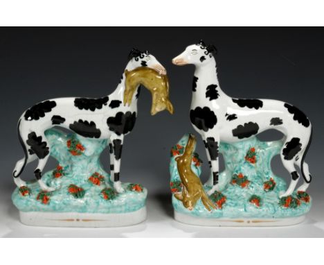 A PAIR OF STAFFORDSHIRE EARTHENWARE MODELS OF   GREYHOUNDS, C1850 27 and 28cm h++First -  professional restoration to left ea