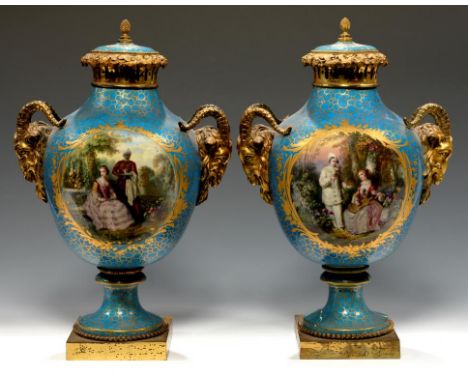 A PAIR OF FRENCH ORMOLU MOUNTED SEVRES STYLE PORCELAIN VASES AND COVERS, C1860  painted in the manner of Watteau with a seate