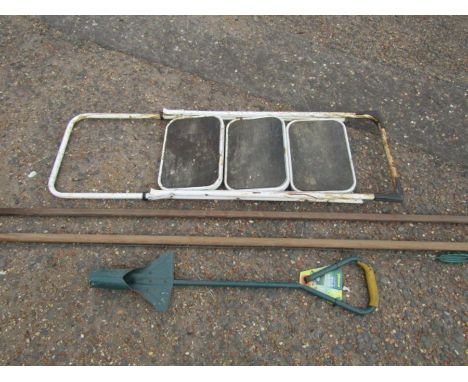 Metal steps and gardening tools 