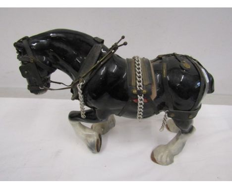 A large ceramic shire horse- leg repaired