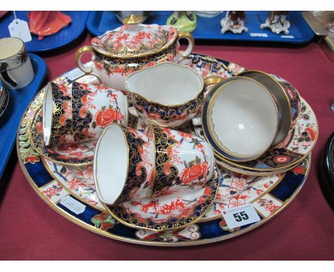 A Royal Crown Derby Imari Part China Coffee Service, comprising four cups and saucers, milk and sucrier, date coded for 1899,