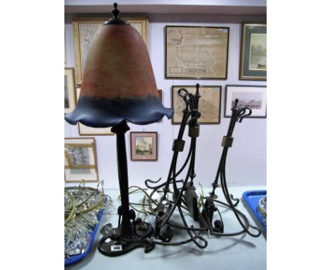 A Reproduction Art Nouveau Style Table Lamp, bell glass shade, wavy edge in mottled orange and blue, on cast metal organic fo