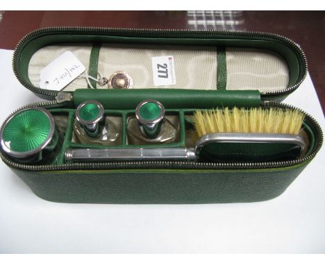 A Medallion Pendant, "Graham Cup R. U. 1928" ; together with a travelling set in case, containing hair brush, jars and bottle