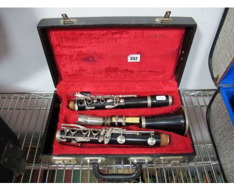 A Four Piece Console Special Clarinet, in fitted plush lined hard protective case.