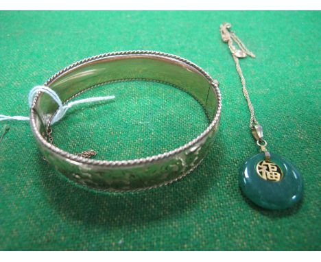 A 9ct Metal Core Bangle, hinged to snap clasp; modern pendant on chain. 