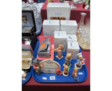 A Collection of Boxed Hummel Figures, including Display Plaque Puppy Love, Girl with Trumpet, Joyful Noise, Baker, Girl with 