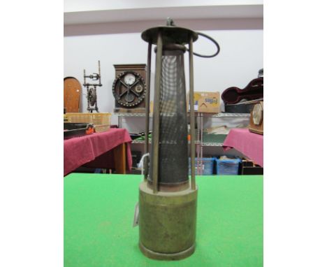 A Brass Framed Four Pillar Miner's Safety Lamp, with exposed gauze and suspension hook.