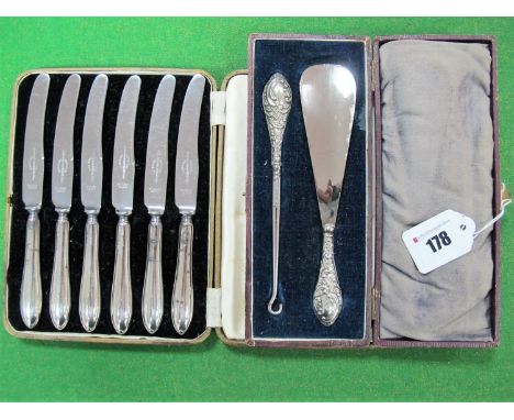 A Cased Set of Six Hallmarked Silver Tea Knives, together with a matching shoe horn and button hook. (2)