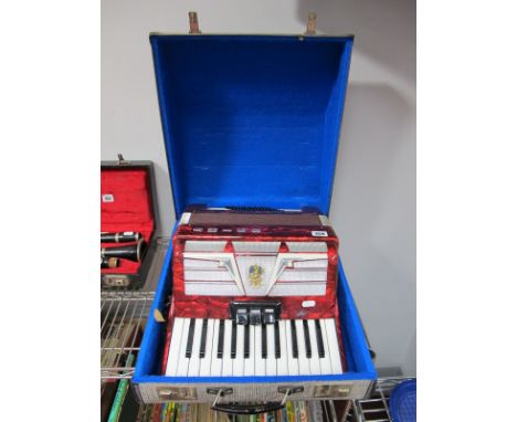 An Argo Piano Accordion, twenty-six key, faux red mother of pearl effect casing. 