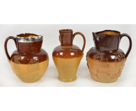 A 19th century Doulton stoneware hunting jug with hallmarked silver rim, height 16.5cm, another similar (lacking silver rim),