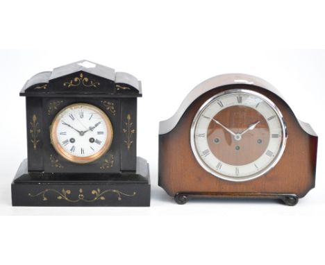 A Victorian black slate mantel timepiece with arched case above circular white enamel dial set with Roman numerals, height 26