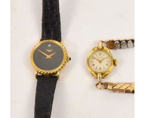An 18ct gold cased Longines lady's manual wind wristwatch with circular black dial set with a single diamond, on black leathe
