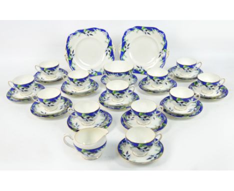 A Grafton China twelve setting tea service decorated with birds in flight, printed marks to base, comprising two sandwich pla