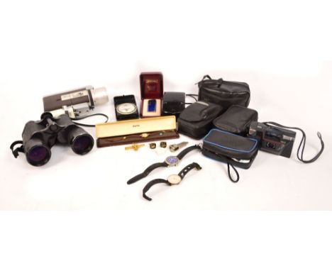 A quantity of cameras including a cased Canon cine camera and manual, a cased pair of 10x50 Dekarem binoculars, a spare binoc