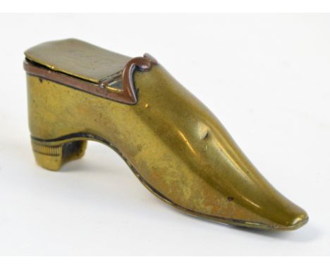 An early 19th century brass snuff box modelled as a ladies shoe, inscribed to lid "W Roberts", length 9cm.