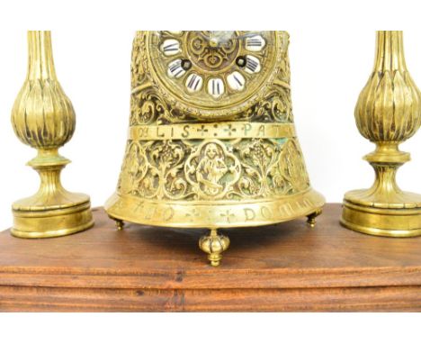 An unusual late 19th century French brass mantel clock, the bell shaped main clock section with circular dial set with Roman 