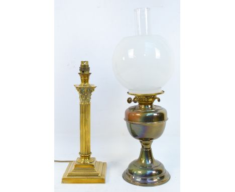 A brass oil lamp with opaque glass shade, height 52cm, and a further brass lamp converted to electricity (2).