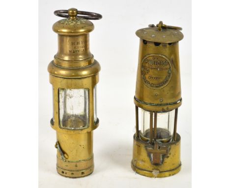 An unusual brass lamp inscribed "H.H. Ford Engineer Macclesfield", height 28cm, and a brass miner's lamp "The Protector" (2).