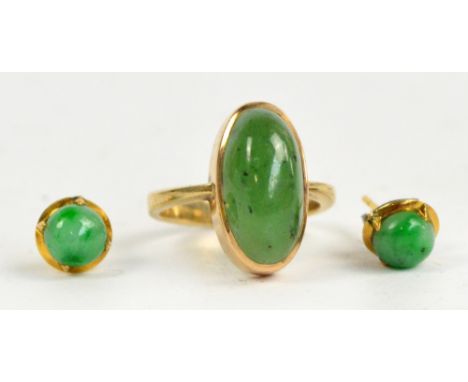 A gold and oval cabochon jade set ring, size J, and a pair of jadeite ear studs (one butterfly clasp missing) (3).