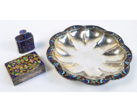 A beaten silver petal shaped small bowl with band of cloisonné enamelled decoration, stamped 925, diameter 14.5cm, a white me