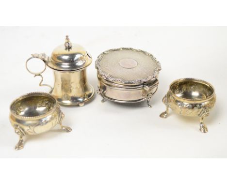 A pair of Victorian hallmarked silver circular open salts embossed with floral sprays, London 1864, an Edward VII silver must