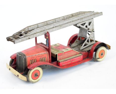 A vintage Mettoy tinplate clockwork fire engine.