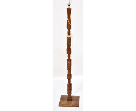 A contemporary African figural standard lamp.