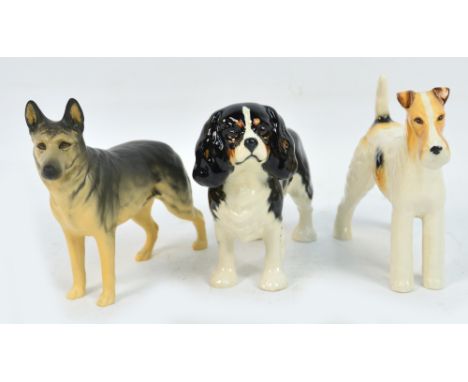 Three Beswick dogs; Champion Ulrica of Brittas, Champion Talavera Romulus and a spaniel. CONDITION REPORT: Appears good with 