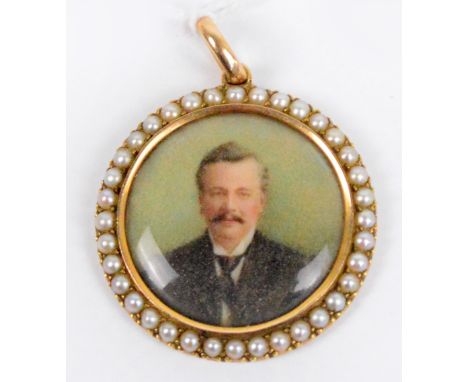 A 9ct gold framed circular pendant, the central panel set with a miniature watercolour of a moustachioed man within a cut cul