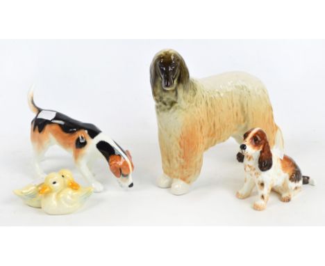 Three ceramic dogs comprising a USSR Afghan hound, an Alton bloodhound, and an Alton spaniel, also a Goebel figure of two duc