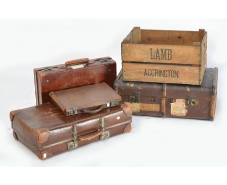 Two leather suitcases, a leather briefcase, a wooden bound trunk, and a wooden crate (5).