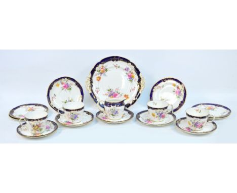 A Royal Crown Derby floral transfer decorated part tea set, comprising four cups, six saucers (three different sizes), sandwi