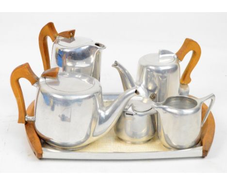 A six piece Picquot ware tea service comprising three pots, milk jug, sugar box and tray (6).