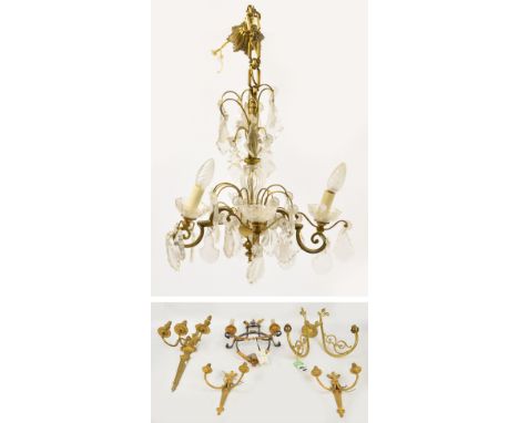 A collection of light fittings comprising a three branch wall sconce, a brass two branch wall sconce with scroll decorated ar