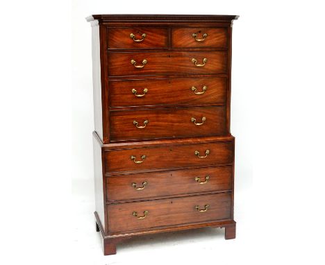 A George III mahogany chest on chest, the moulded dentil cornice above an upper section with two short and three long graduat