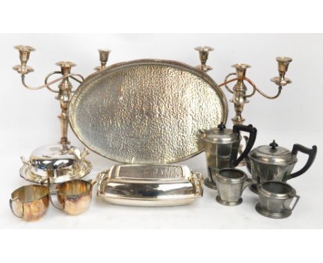 A quantity of plated items including an oval tray with pierced gallery, a tureen, candelabra etc, also a pewter four piece te