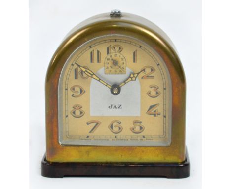 An Art Deco French brass and brown bakelite alarm clock, the arched dial set with Arabic numerals inscribed "Jaz", raised on 