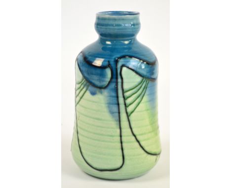 A Minton secessionist ribbed vase glazed in shades of light green and blue and with tube lined stylised floral decoration, im