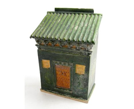 A Ming Dynasty sancai glazed pottery model of a house, the ribbed sloping roof above a single door flanked by windows, in gre
