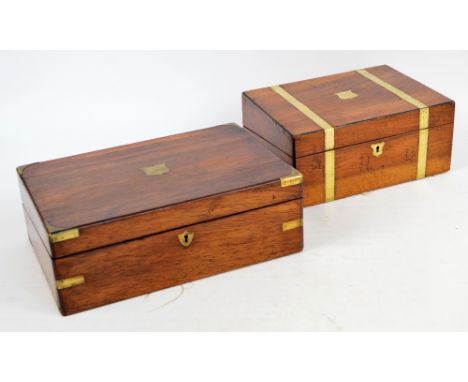 A 19th century rosewood veneered writing slope, with brass mounts to the corners centred with a shield shaped vacant cartouch