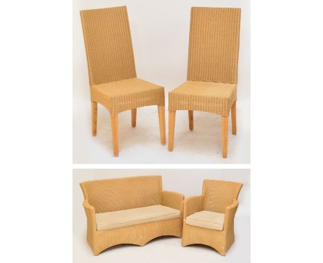 A Lloyd Loom two seater sofa, matching tub chair and a pair of Lloyd Loom dining chairs (4).