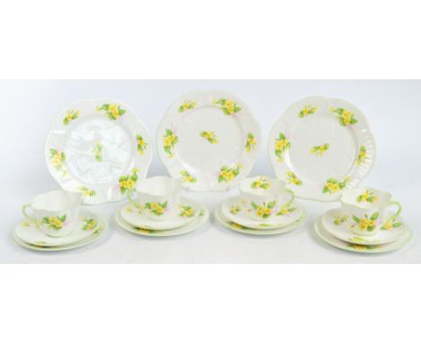 A Shelley "Primrose" part tea set comprising four cups, four saucers, four side plates, and three larger plates. CONDITION RE