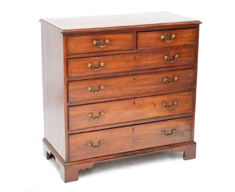 An unusual George III mahogany chest of drawers, the moulded rectangular top above two short and four long graduated drawers 
