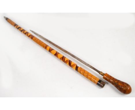 An early 20th century sword stick with leaf carved and painted scabbard, length 89cm. CONDITION REPORT: Split to top end of s