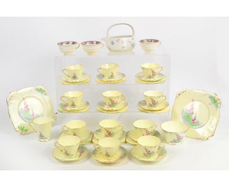 A 1930s New Chelsea Staffs "Foxglove" tea service comprising twelve cups, twelve saucers, nine side plates, two cake plates, 