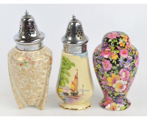 A ceramic sugar shaker modelled as a rocket with gilt heightened decoration and chrome plated lid, height 17.5cm, a James Ken