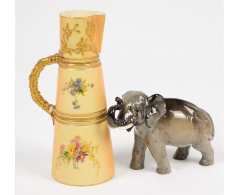 A Royal Doulton elephant, no.2644 and a Royal Worcester blush ivory jug, painted with floral sprays (handle af) (2). CONDITIO