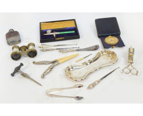 A mixed lot of collectors' items including plated candle snuffer and tray, glove stretchers, button hook, champagne tap, oper