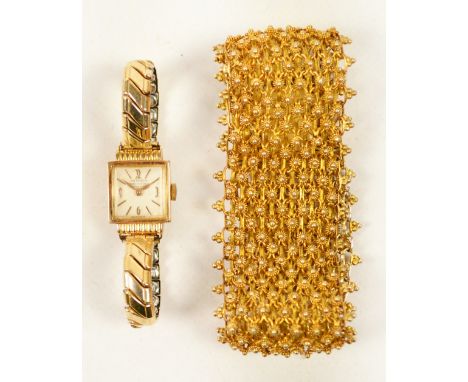 MITHRA; an 18ct yellow gold cased lady's wristwatch, the square enamel dial bearing baton and Arabic numerals inscribed "Mith