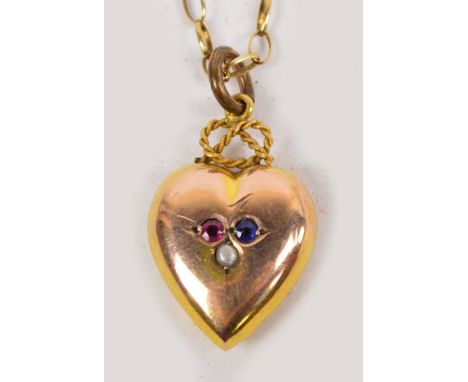 A 9ct yellow gold heart shaped pendant set with a garnet, sapphire and seed pearl suspended by a 9ct gold chain, approx 3.7g.